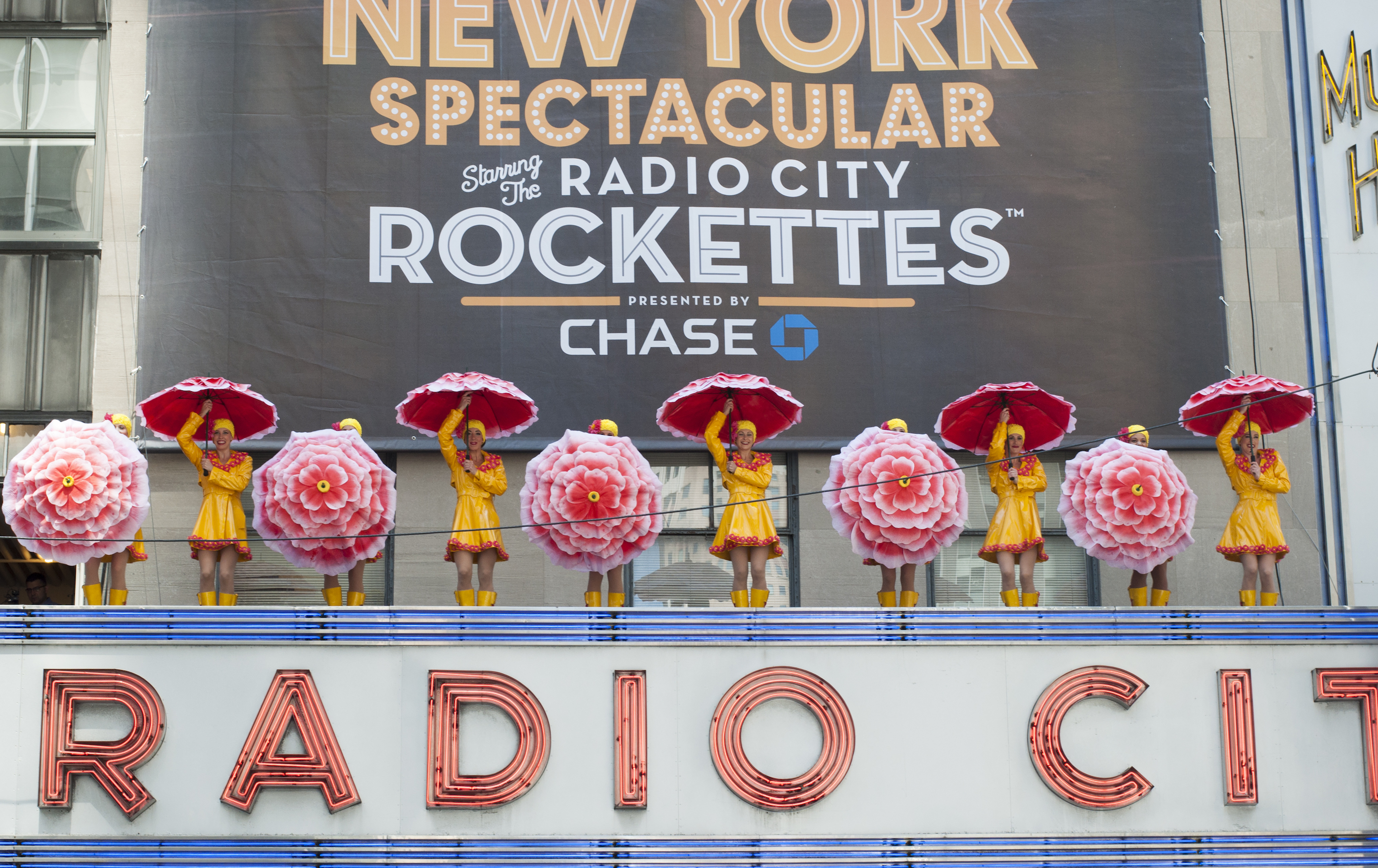 Radio City Rockettes Reveal NYC Banner Atop Marquee